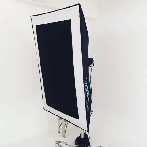 A rectangular photographic softbox on a lighting stand.